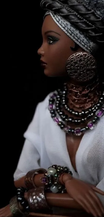 Elegant doll with tribal attire and intricate jewelry in a dark setting.