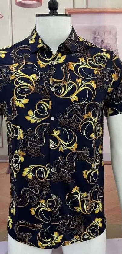 Black shirt with gold dragon print design, displayed in a stylish setting.