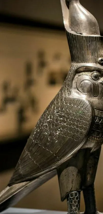 Metallic Egyptian falcon sculpture intricately detailed.