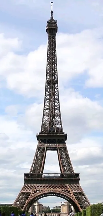 Elegant view of the Eiffel Tower in Paris against a blue sky.