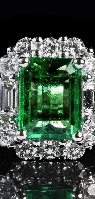 Emerald ring with diamonds on elegant wallpaper.