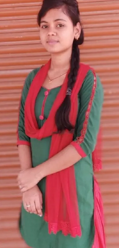 Woman in red and green ethnic attire.