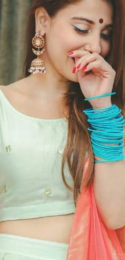 Woman in elegant ethnic attire with vibrant accessories.