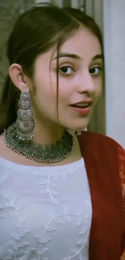 Portrait of a woman in traditional ethnic attire with silver jewelry.