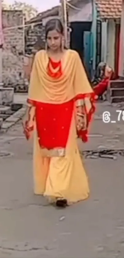 Ethnic fashion walk with red and yellow attire.