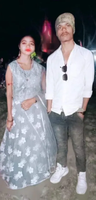 Elegant couple in evening attire at an event, showcasing a stylish and modern look.