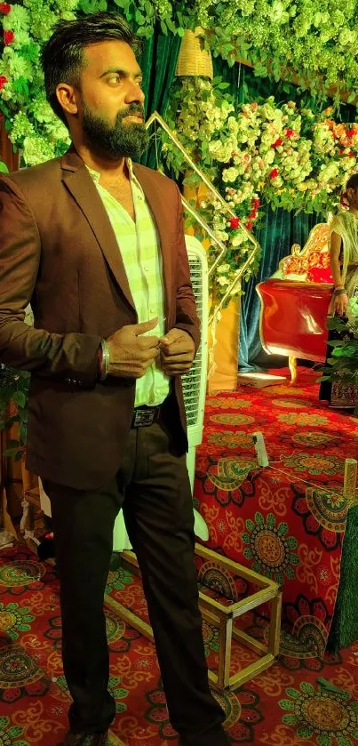 Person in suit at elegant, green-themed event with floral decor.