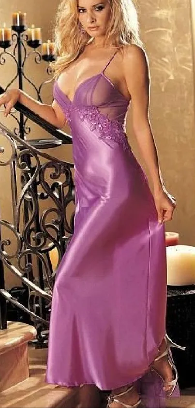 Elegant lady in a purple evening gown standing by a staircase.