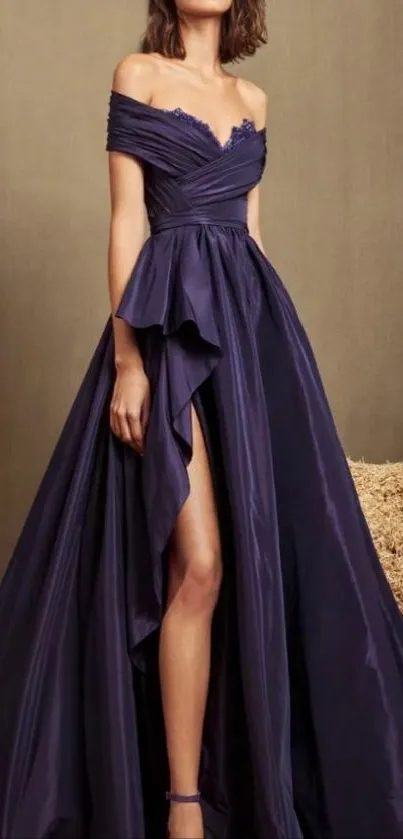 Woman in an elegant dark purple evening gown with a stylish pose.