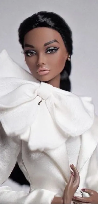 Elegant doll in stylish white outfit with delicate details.