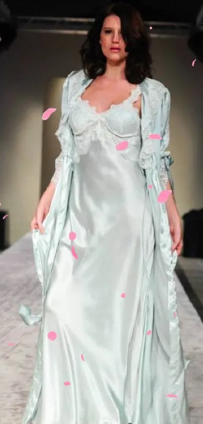 Model showcasing elegant silk fashion on the runway.