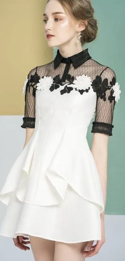 Elegant white dress with lace sleeves in a modern setting.