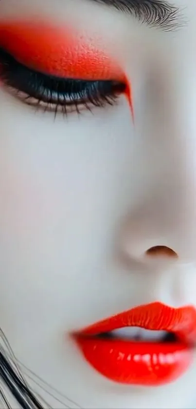 Close-up of a woman's face with vivid red makeup.