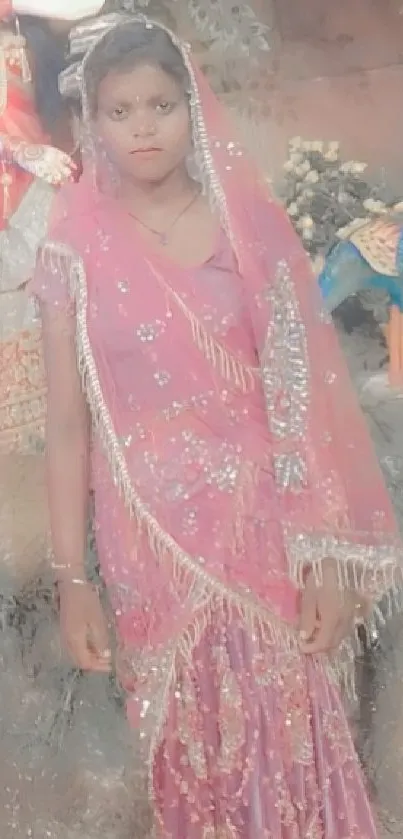 Woman in elegant sari with colorful backdrop.