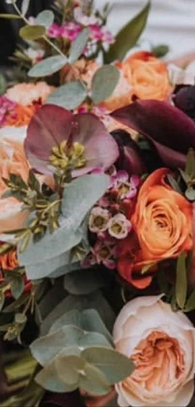 Elegant bouquet of roses and greenery in soft peach and purple hues.