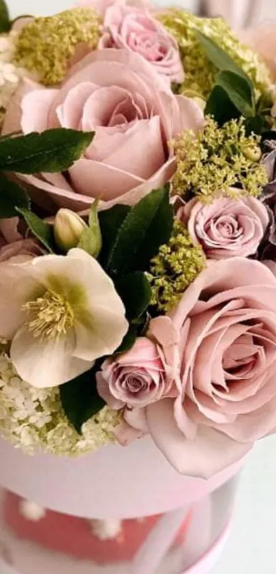 Elegant bouquet of soft pink roses and greenery.