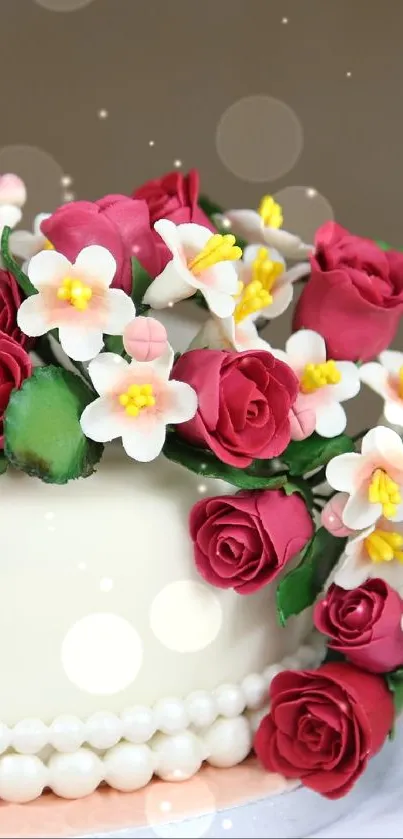Elegant cake with red and white floral decorations on a neutral background.