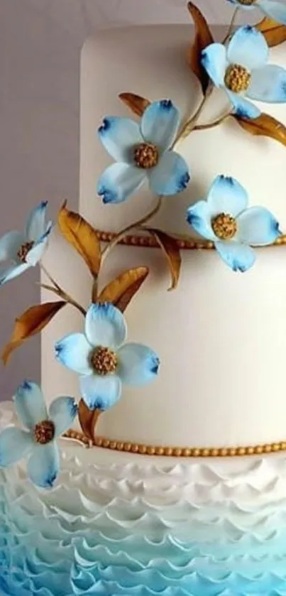 Elegant white cake with blue flowers decor.