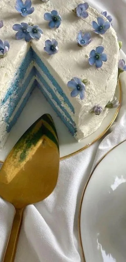 Elegant cake with blue flowers on white background.