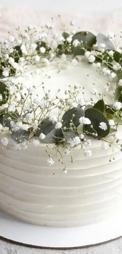 White cake adorned with delicate baby's breath flowers.