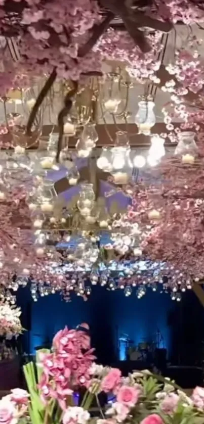 Floral ceiling with pink blossoms and chandeliers.