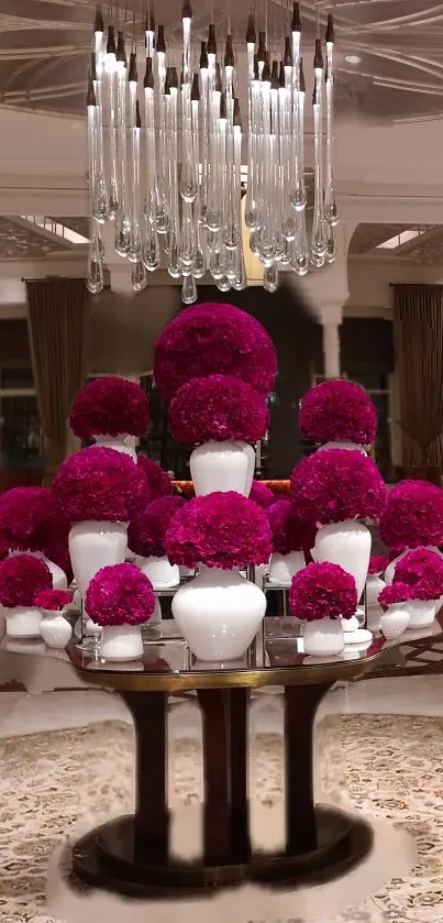 Elegant magenta flower display with chandelier.