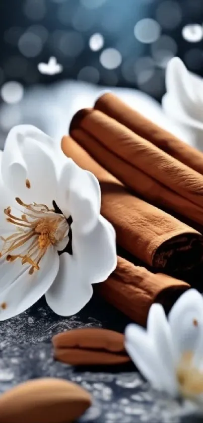 White flowers and cinnamon sticks on textured surface.