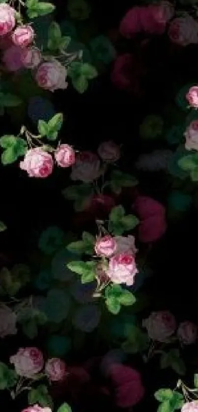 Dark wallpaper with pink roses and green leaves.