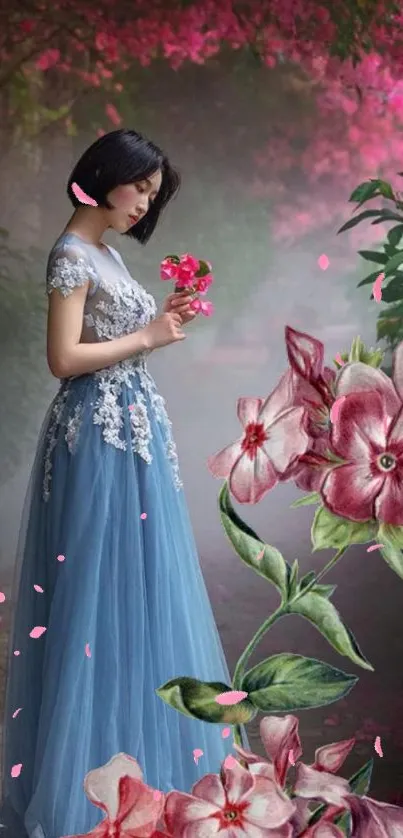 Woman in a blue gown surrounded by pink flowers.