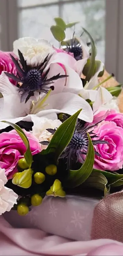 A bouquet of pink and white flowers wrapped elegantly, with a soft pink background.