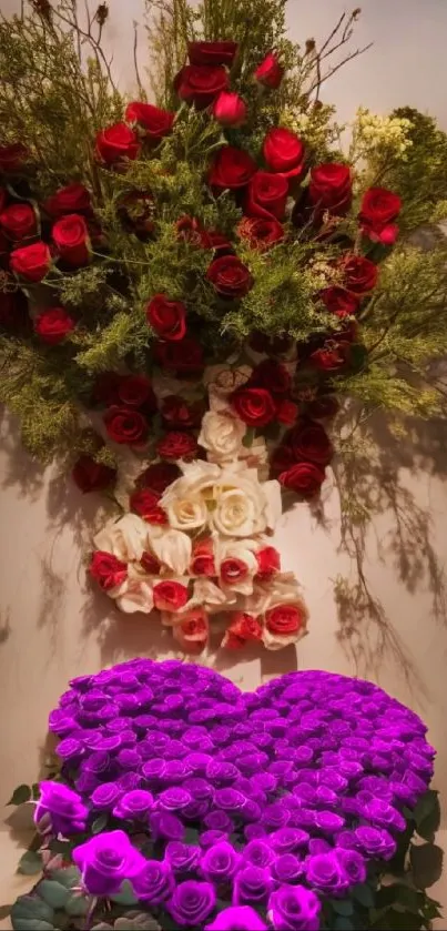 Heart-shaped floral arrangement with red, white, and purple roses on wallpaper.