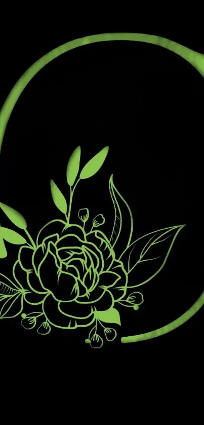 Green floral initial on black background wallpaper.