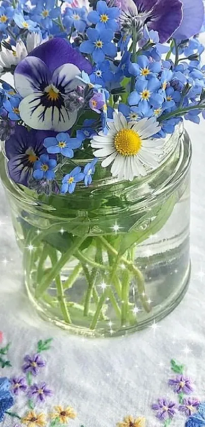 Flower bouquet in a glass jar with blue and purple hues.