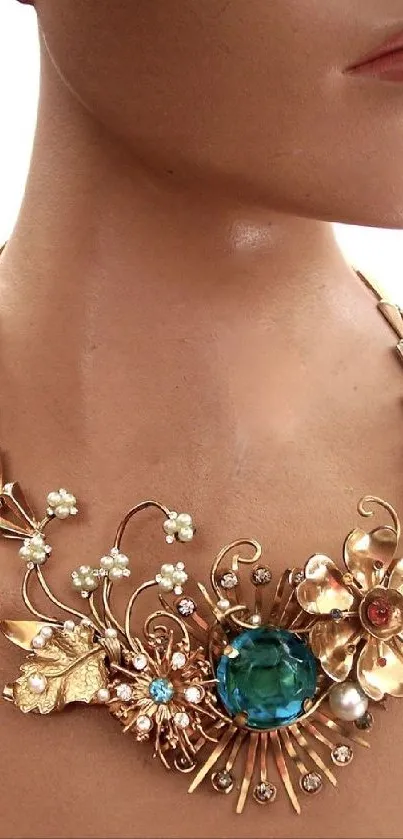 An artistic floral necklace with golden tones and intricate details.