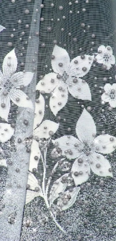 Elegant floral lace wallpaper with white flowers on a soft grey background.