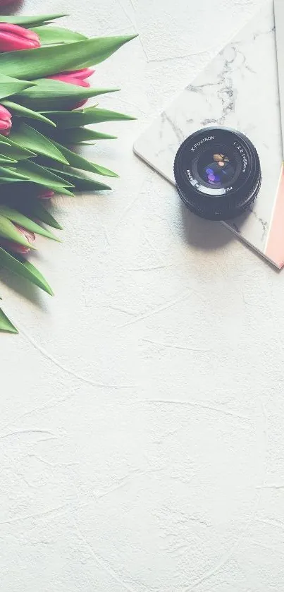 Floral mobile wallpaper with pink tulips and camera lens.