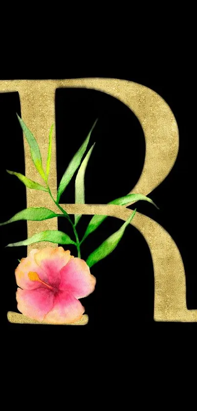 Gold letter R with pink flower and green leaves on black background.