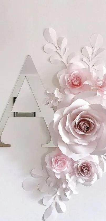 Elegant floral letter with pastel pink roses on a modern wallpaper.