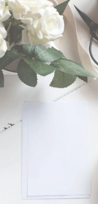 Elegant white roses and leaves on a minimalist surface.