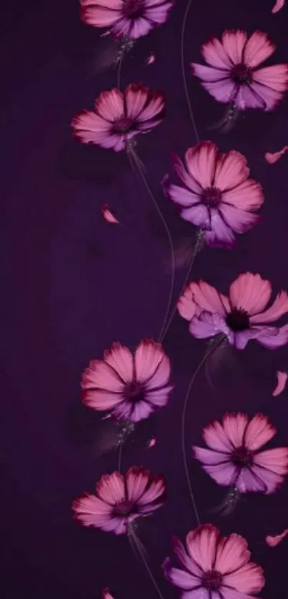 Elegant floral wallpaper with pink flowers on a dark purple background.