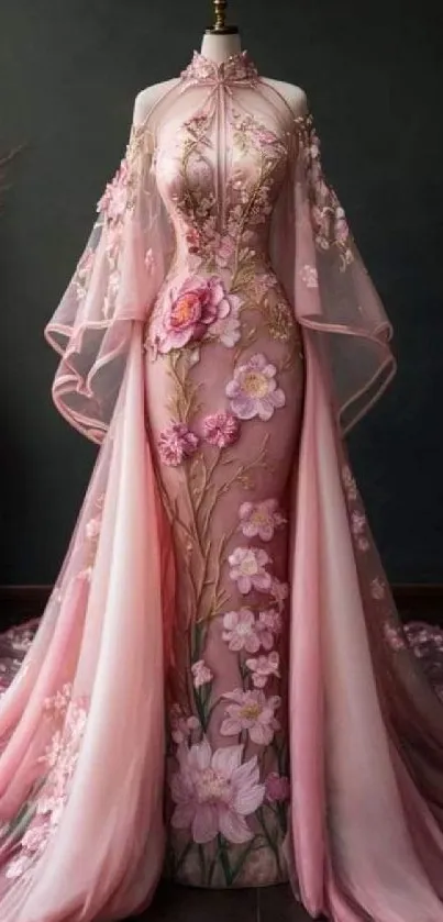 Elegant pink floral dress with intricate embroidery on dark background.