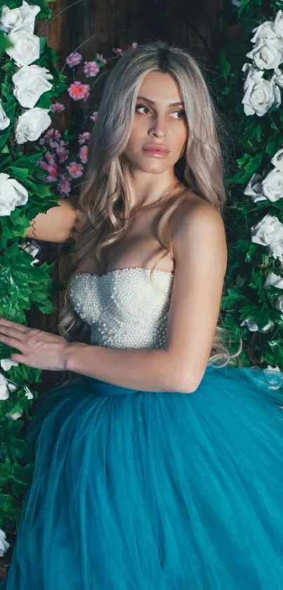 Elegant woman in teal dress surrounded by lush white flowers.