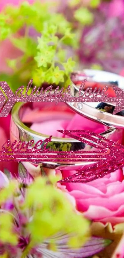 Mobile wallpaper with elegant rings and pink flowers.