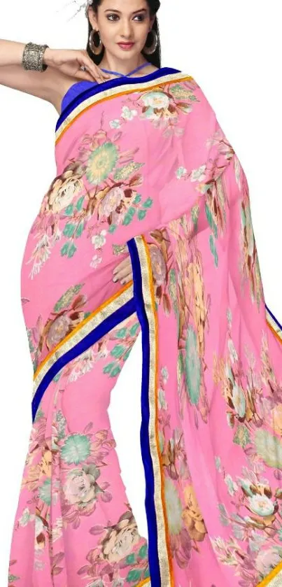 Elegant pink sari with floral designs and blue borders.