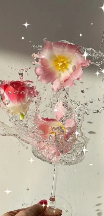 Pink flowers splashing in water within a glass, creating an elegant aesthetic.