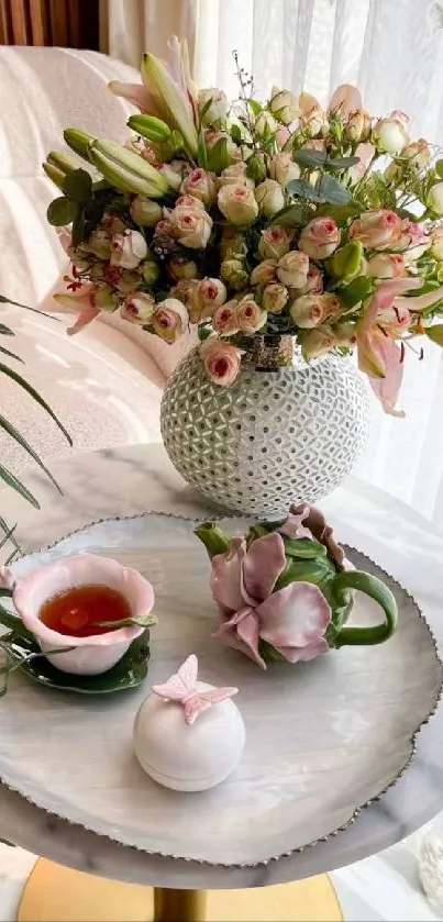 Elegant table with pastel floral arrangement and delicate decor.