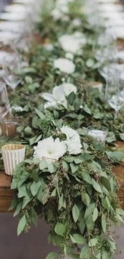 Elegant table with green and white floral centerpiece.