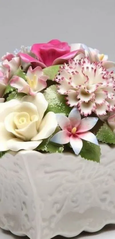 Elegant floral arrangement in a decorative vase, featuring colorful flowers.