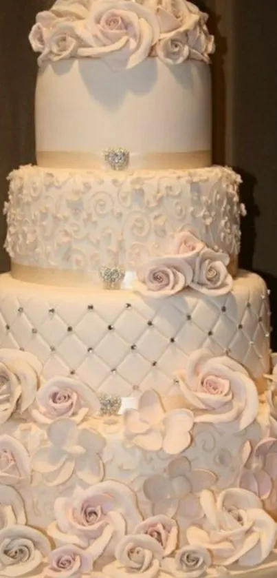 Three-tier floral wedding cake with roses.