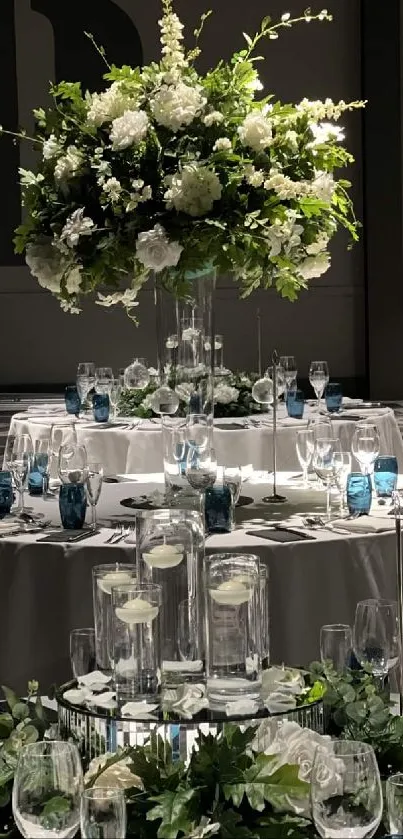 Elegant wedding table with floral centerpiece and sleek glassware.